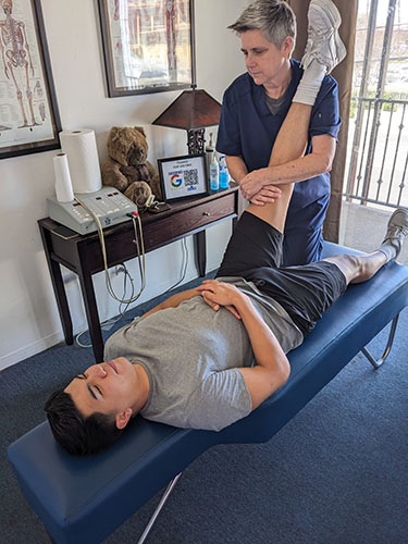 Chiropractor in Duarte, CA performing PNF on a patient